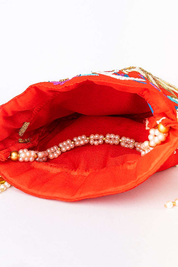 Red & White Raw Silk Embroidered Potli by NR By Nidhi Rathi at Pernia's Pop Up Shop