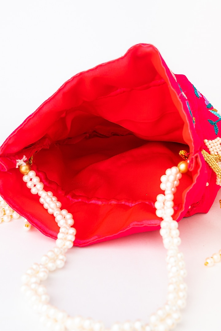 Pink & Purple Raw Silk Embroidered Potli by NR By Nidhi Rathi at Pernia's Pop Up Shop