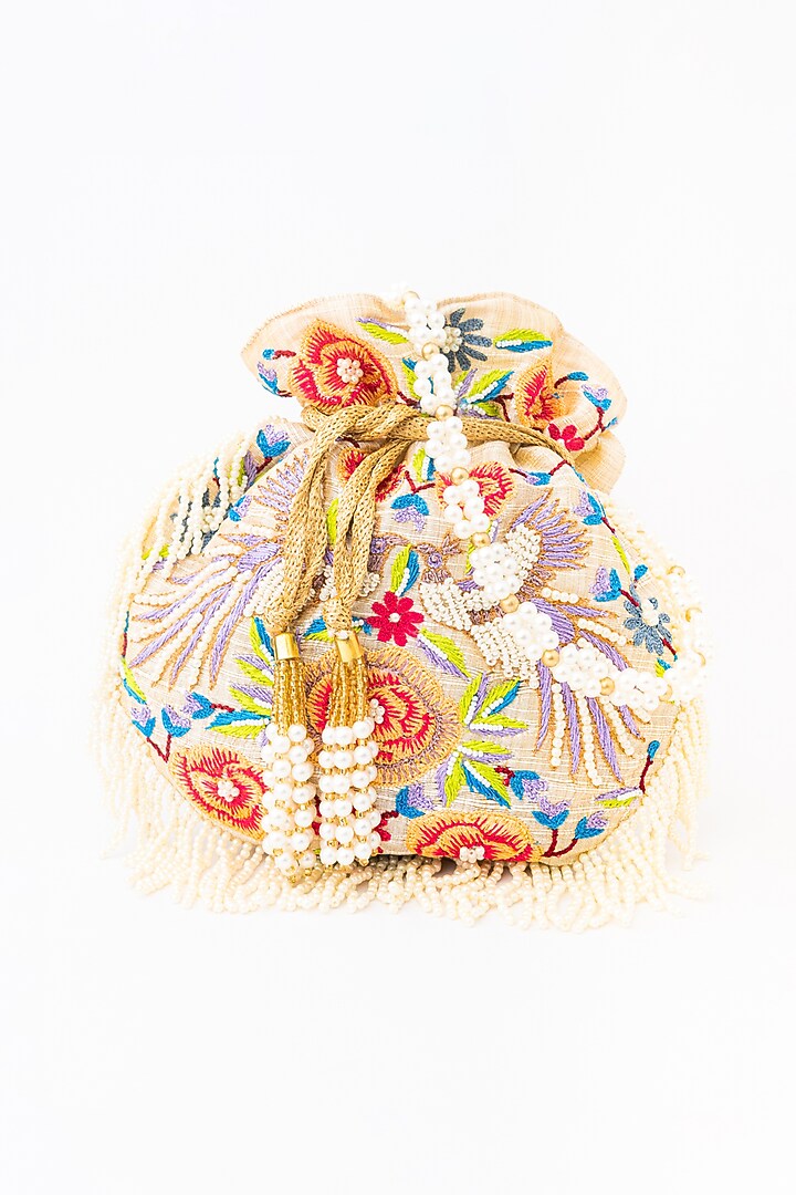 Cream & Purple Raw Silk Embroidered Potli by NR By Nidhi Rathi at Pernia's Pop Up Shop