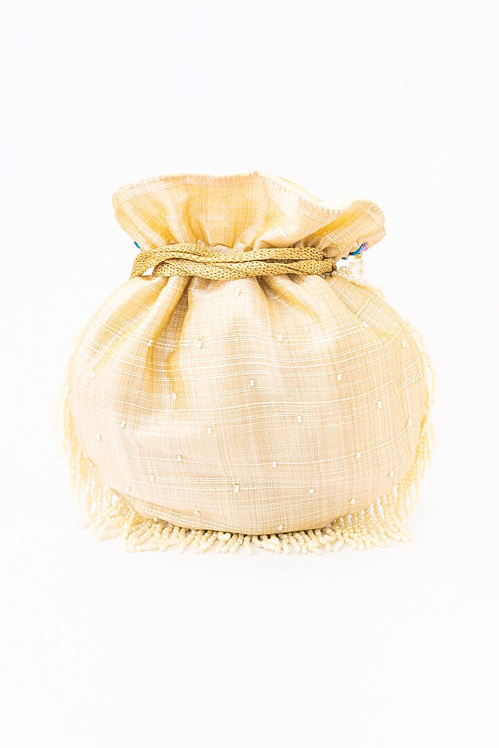 Cream & Purple Raw Silk Embroidered Potli by NR By Nidhi Rathi at Pernia's Pop Up Shop