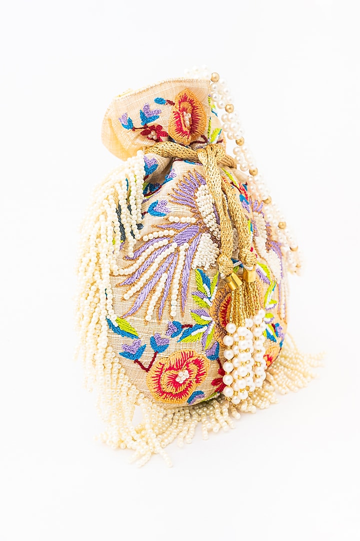 Cream & Purple Raw Silk Embroidered Potli by NR By Nidhi Rathi at Pernia's Pop Up Shop