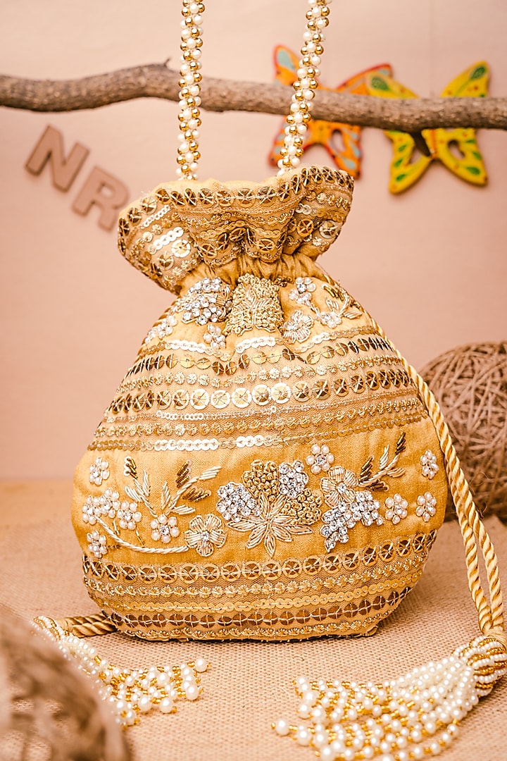 Gold & White Raw Silk Embroidered Potli by NR By Nidhi Rathi