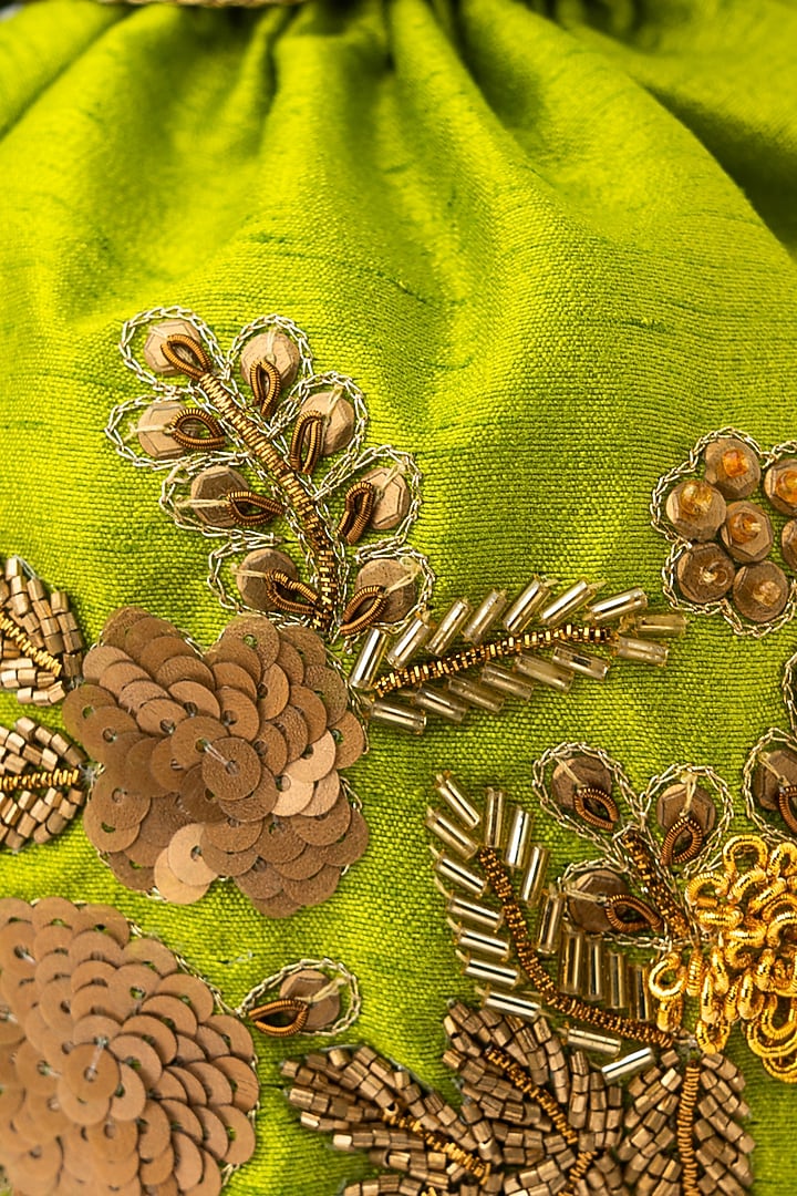 Green & Gold Raw Silk Embroidered Potli by NR By Nidhi Rathi at Pernia's Pop Up Shop