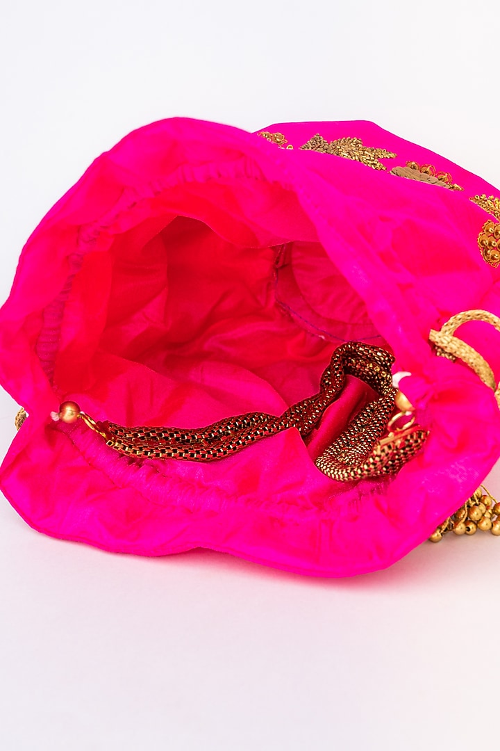 Pink & Gold Raw Silk Embroidered Potli by NR By Nidhi Rathi at Pernia's Pop Up Shop