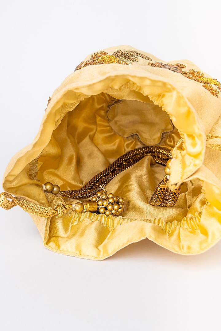 Peach & Gold Raw Silk Embroidered Potli by NR By Nidhi Rathi at Pernia's Pop Up Shop
