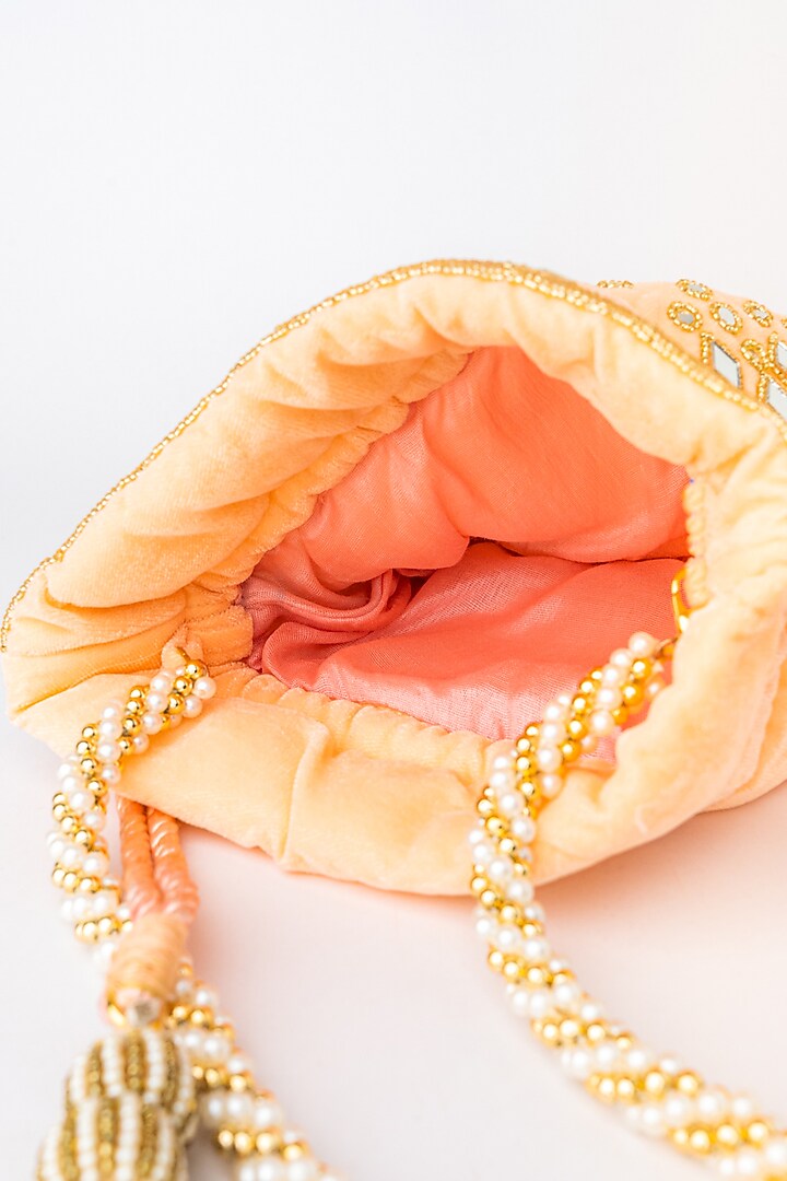 Peach & Gold Velvet Embroidered Potli by NR By Nidhi Rathi at Pernia's Pop Up Shop