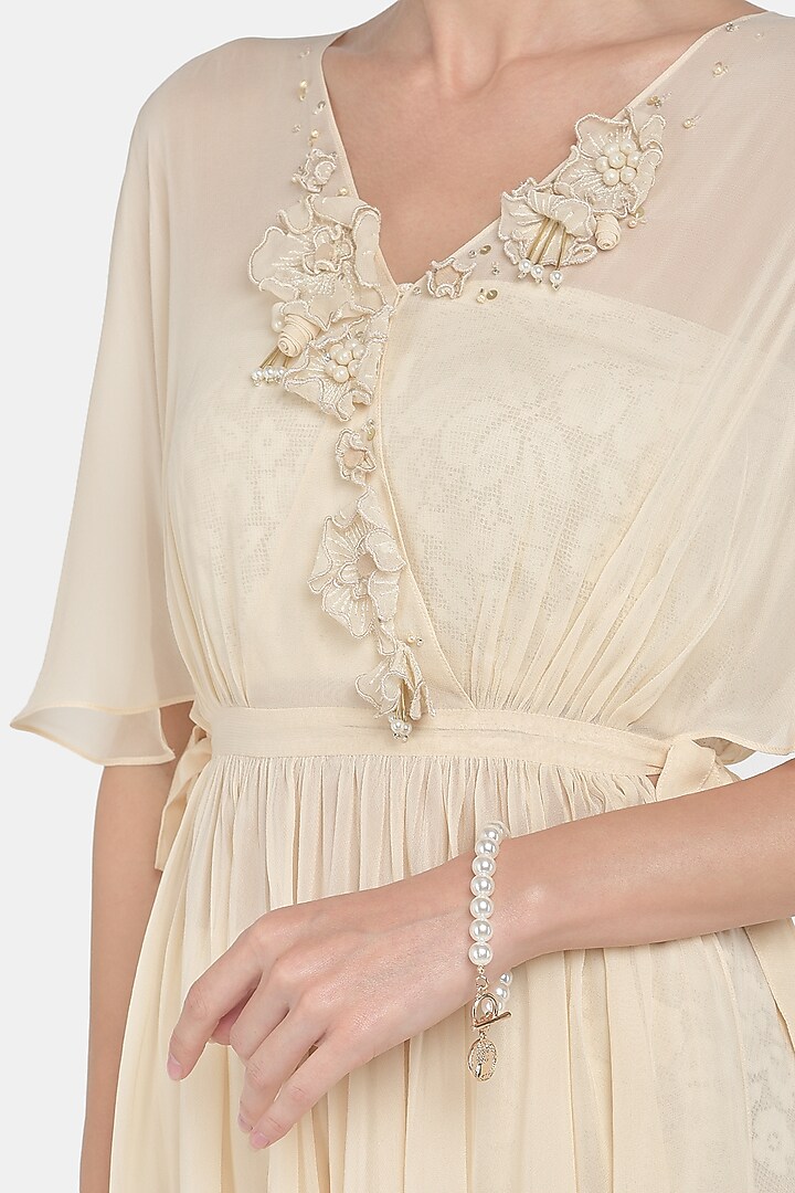 Beige Embroidered Draped Tunic Set by Naina Seth at Pernia's Pop Up Shop