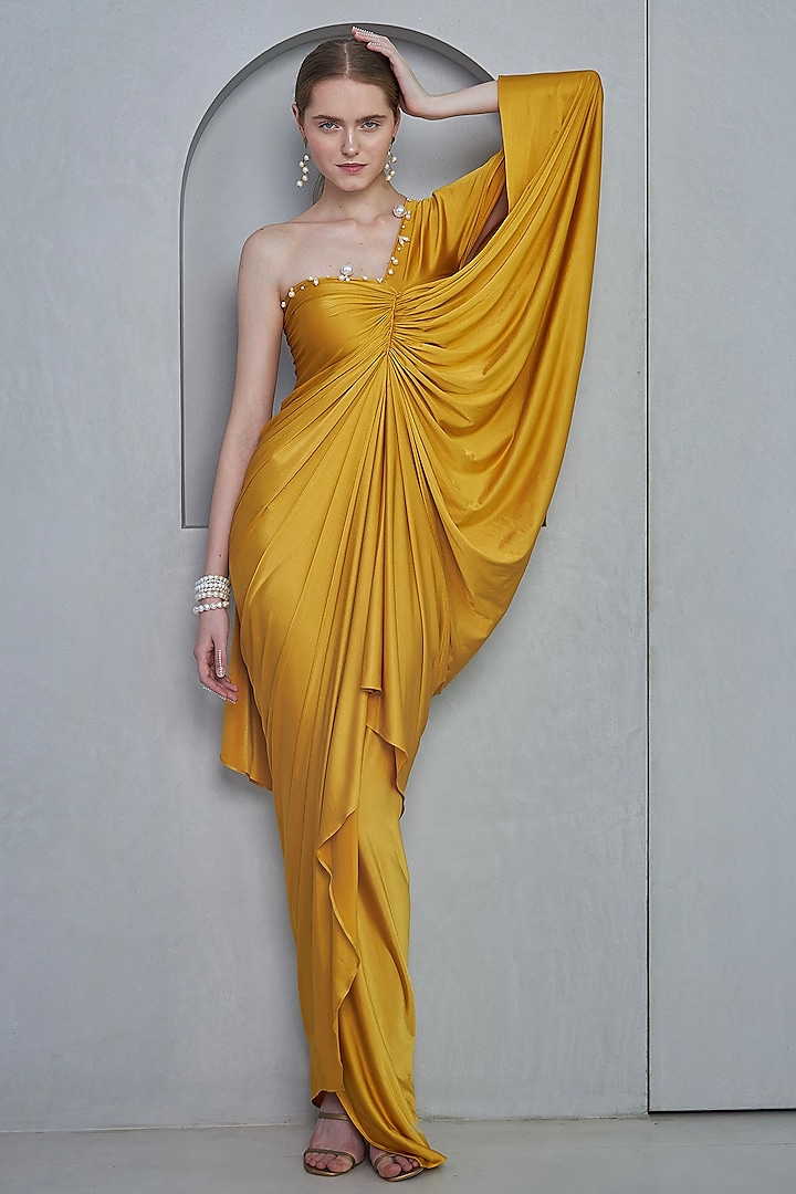 Mustard Stretch Knit Pearl Embellished One-Shoulder Drape Gown by Naina Seth