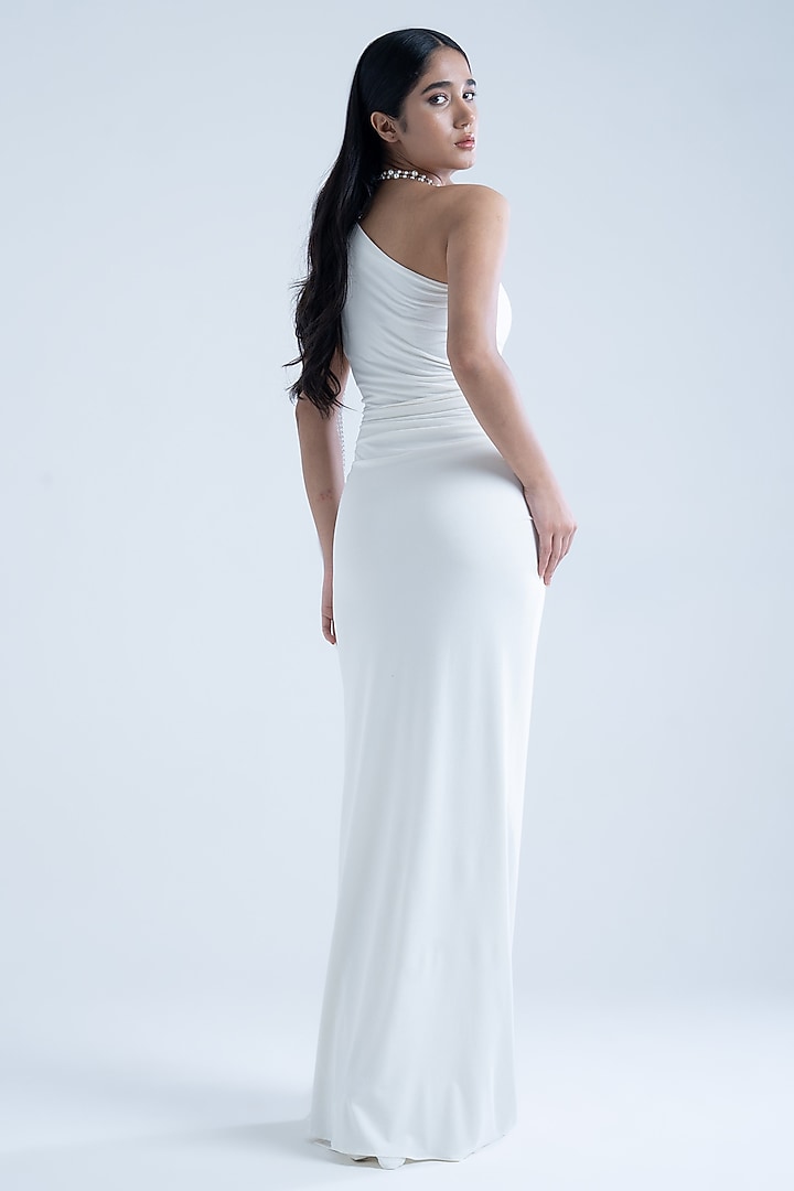 White Stretch Moss Crepe Embellished One-Shoulder Gown by Naina Seth at Pernia's Pop Up Shop