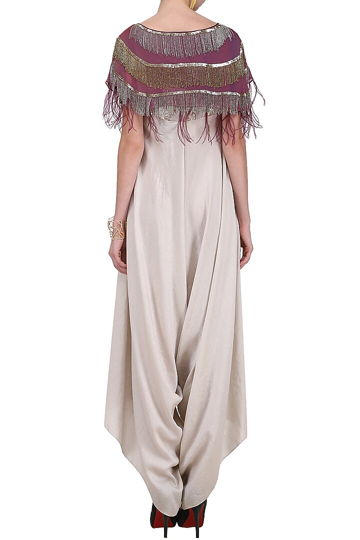 Cream jumpsuit with wine tassels cape available only at Pernia's Pop Up Shop.