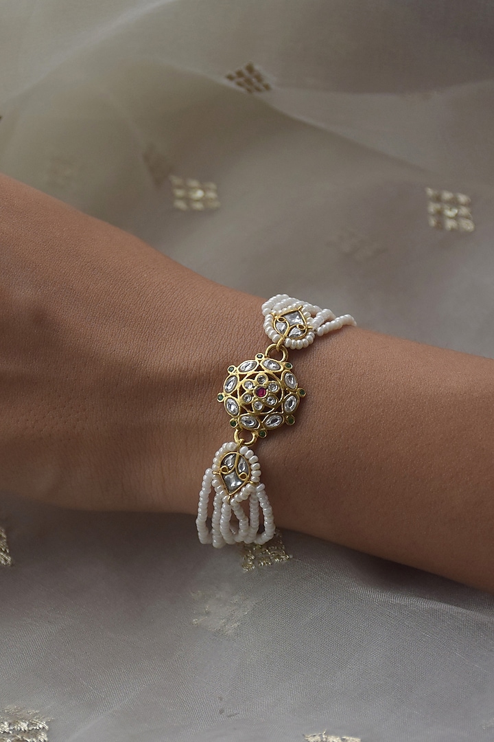 Gold Plated Kundan Polki & Seed Pearl Bracelet In Sterling Silver by Nuvi Jewels