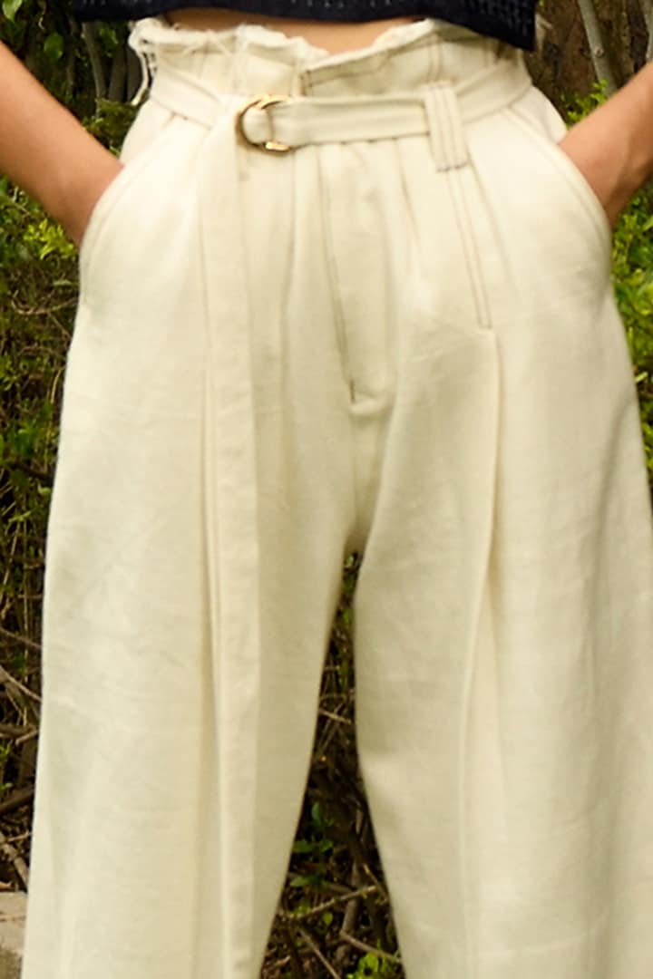 White Pleated Wide-Legged Trousers by Ode To Odd at Pernia's Pop Up Shop