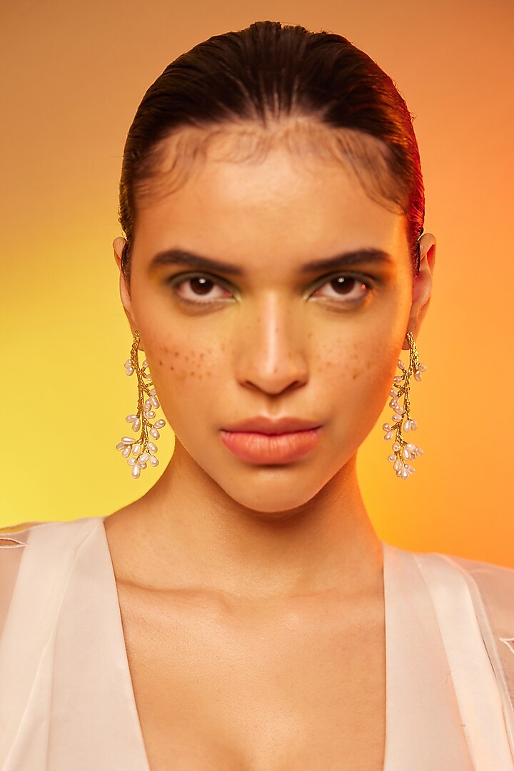 Gold Finish Pearl Dangler Earrings In Sterling Silver by ODE at Pernia's Pop Up Shop