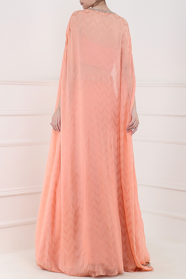 Coral embroidered lehenga, crop top and cape set available only at Pernia's Pop Up Shop.