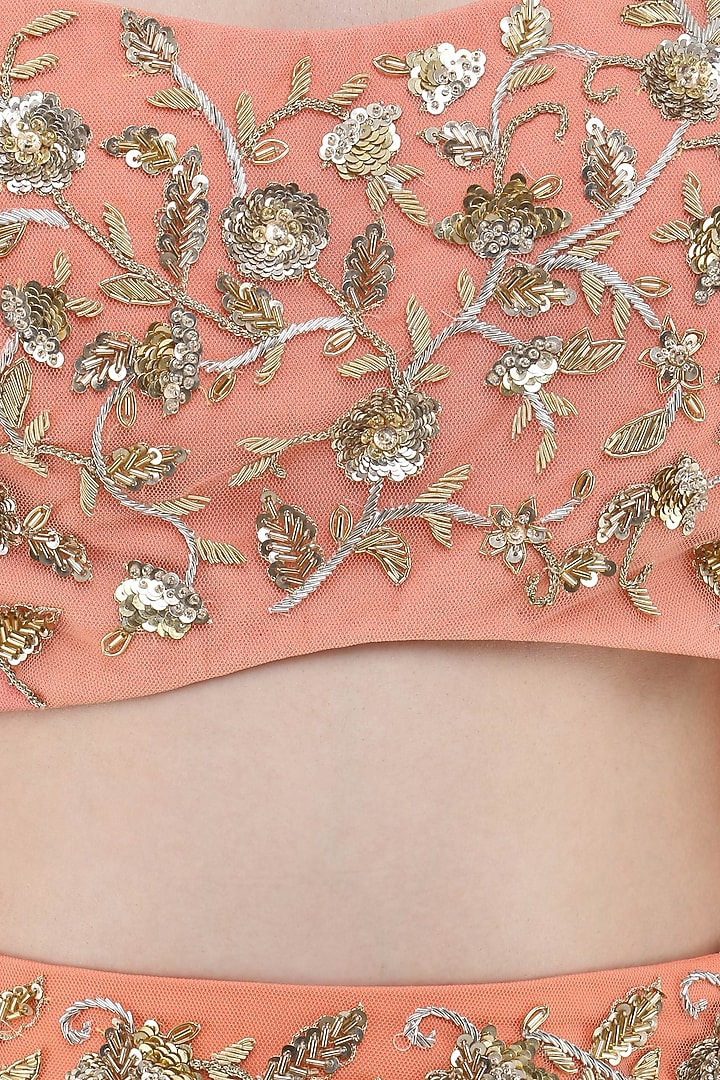 Coral embroidered lehenga, crop top and cape set available only at Pernia's Pop Up Shop.