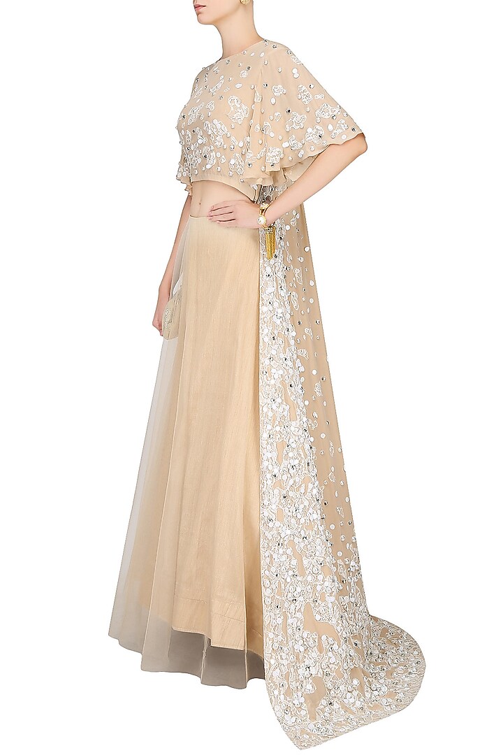 Beige floral lace cutwork cape blouse and lehenga skirt set available only at Pernia's Pop Up Shop.