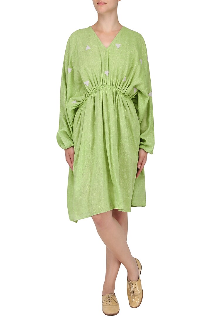 Green pleated kaftan dress available only at Pernia's Pop Up Shop.