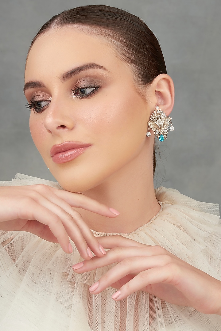 White Plated Swarovski Stud Earrings by Opalina at Pernia's Pop Up Shop