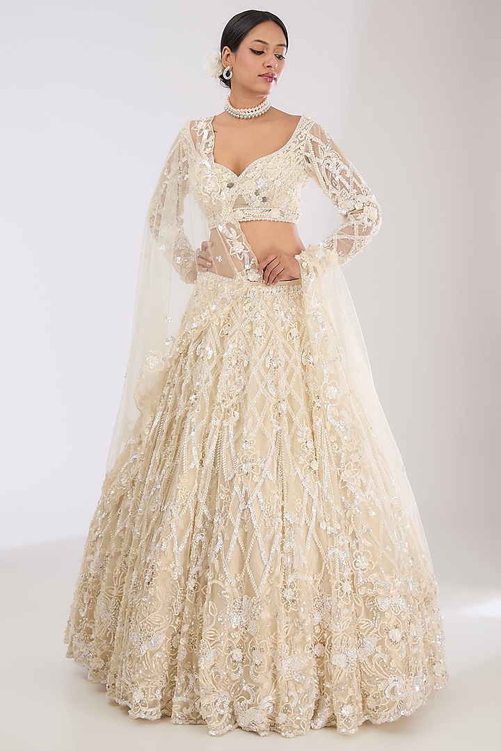 Ivory Tulle Net & Viscose Satin Hand Embroidered Wedding Lehenga Set by OPUS ATELIER at Pernia's Pop Up Shop