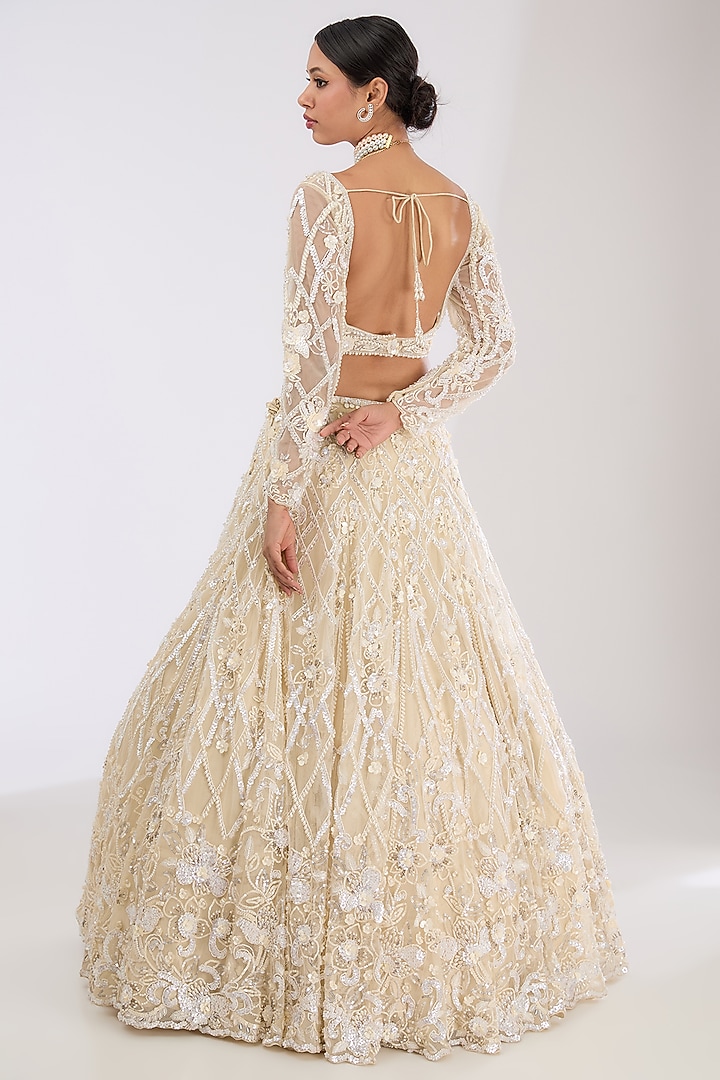 Ivory Tulle Net & Viscose Satin Hand Embroidered Bridal Lehenga Set by OPUS ATELIER at Pernia's Pop Up Shop