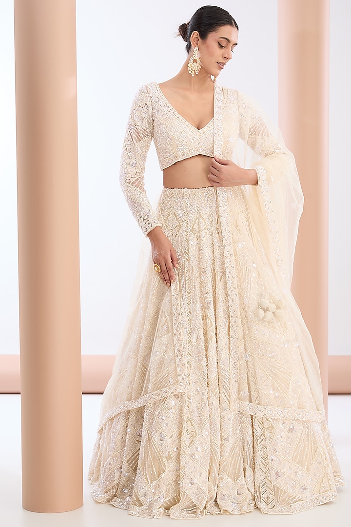 Ivory Tulle Net & Satin Sequins Embellished Bridal Lehenga Set by OPUS ATELIER at Pernia's Pop Up Shop