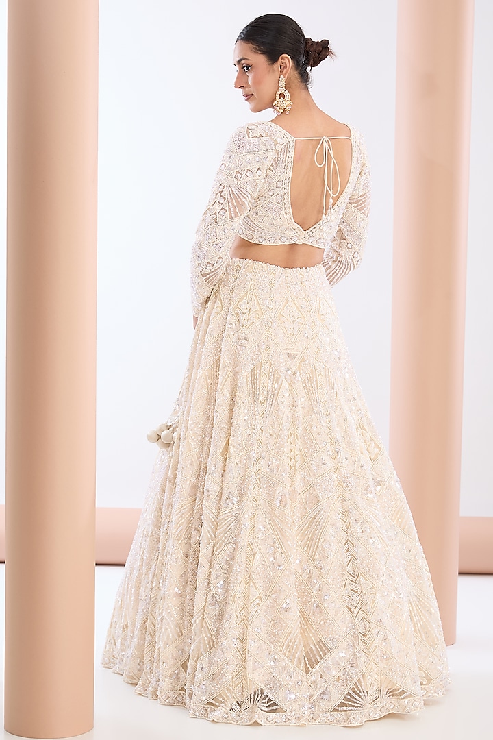 Ivory Tulle Net & Satin Sequins Embellished Bridal Lehenga Set by OPUS ATELIER at Pernia's Pop Up Shop