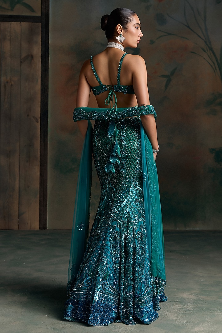 Teal Blue Net Embellished Fish-Cut Bridal Bridal Lehenga Set by OPUS ATELIER at Pernia's Pop Up Shop