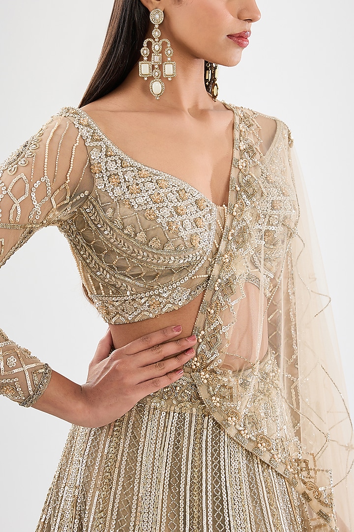 Champagne Gold Tulle Net Hand Embroidered Bridal Lehenga Set by OPUS ATELIER at Pernia's Pop Up Shop