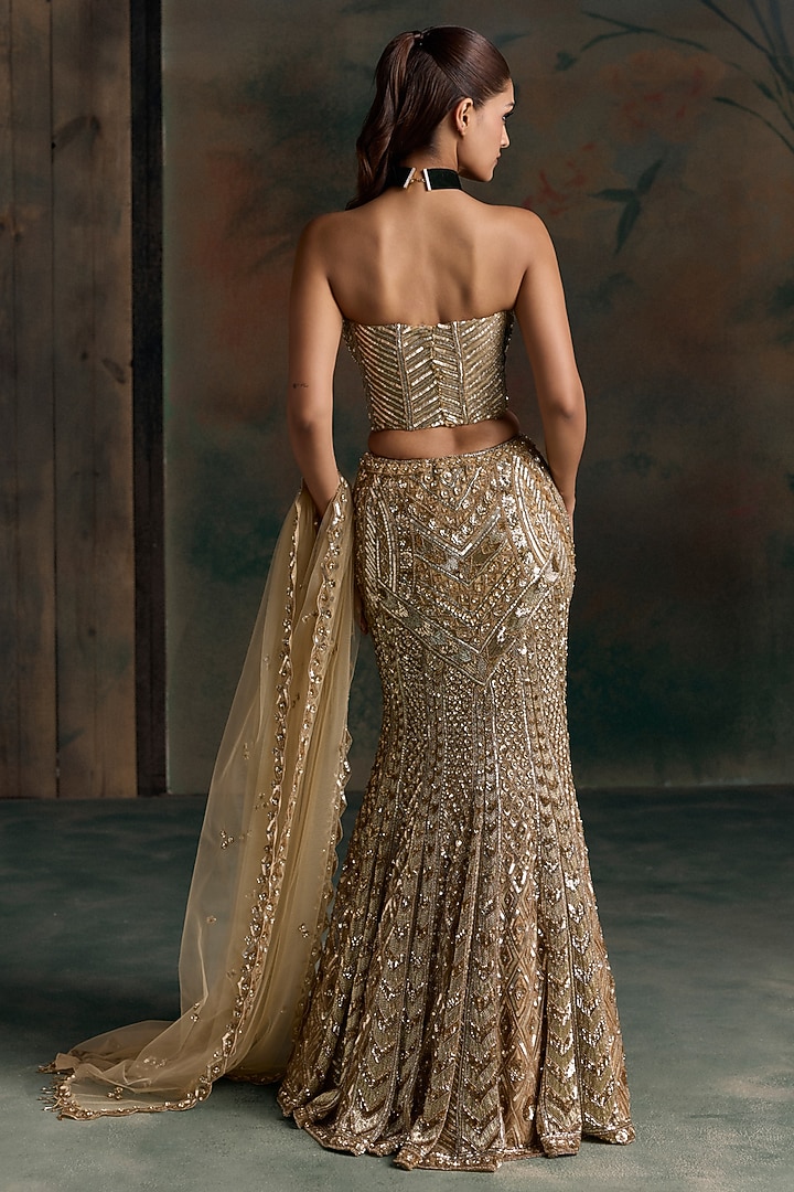 Gold Net Embroidered Fish-Cut Bridal Bridal Lehenga Set by OPUS ATELIER at Pernia's Pop Up Shop