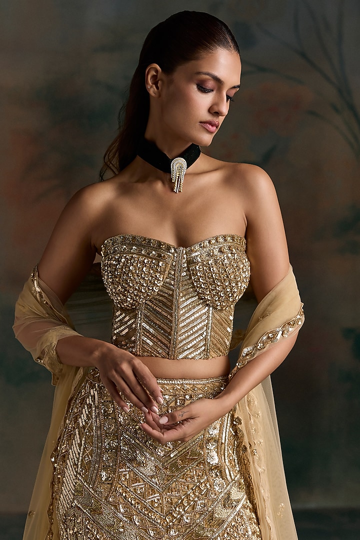 Gold Net Embroidered Fish-Cut Bridal Bridal Lehenga Set by OPUS ATELIER at Pernia's Pop Up Shop