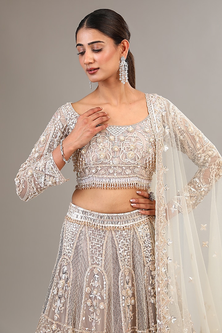 Ivory Tulle Net Sequins & Crystal Embroidered Bridal Lehenga Set by OPUS ATELIER at Pernia's Pop Up Shop