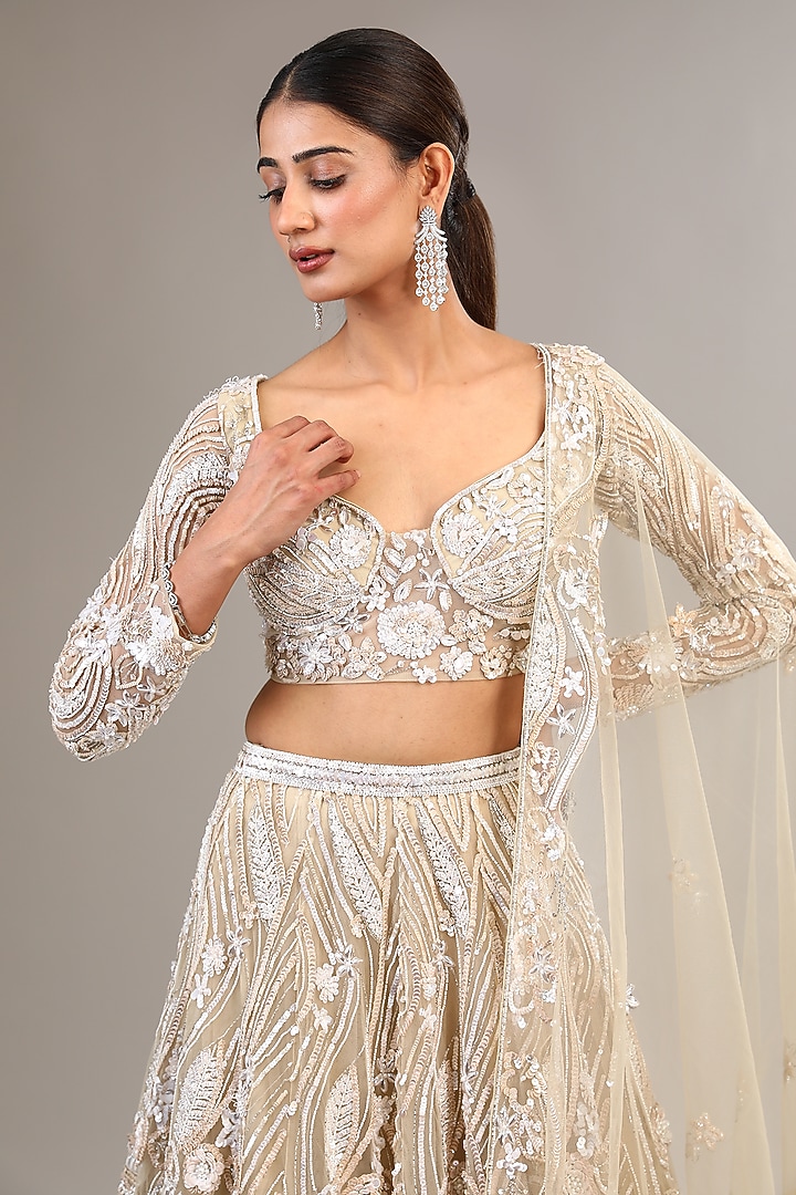 Ivory Tulle Net Sequins & Pearl Embellished Bridal Lehenga Set by OPUS ATELIER at Pernia's Pop Up Shop