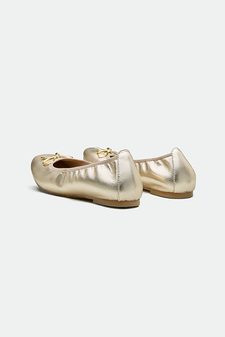 Gold Genuine Leather Metallic Bow Juttis by Oroh at Pernia's Pop Up Shop