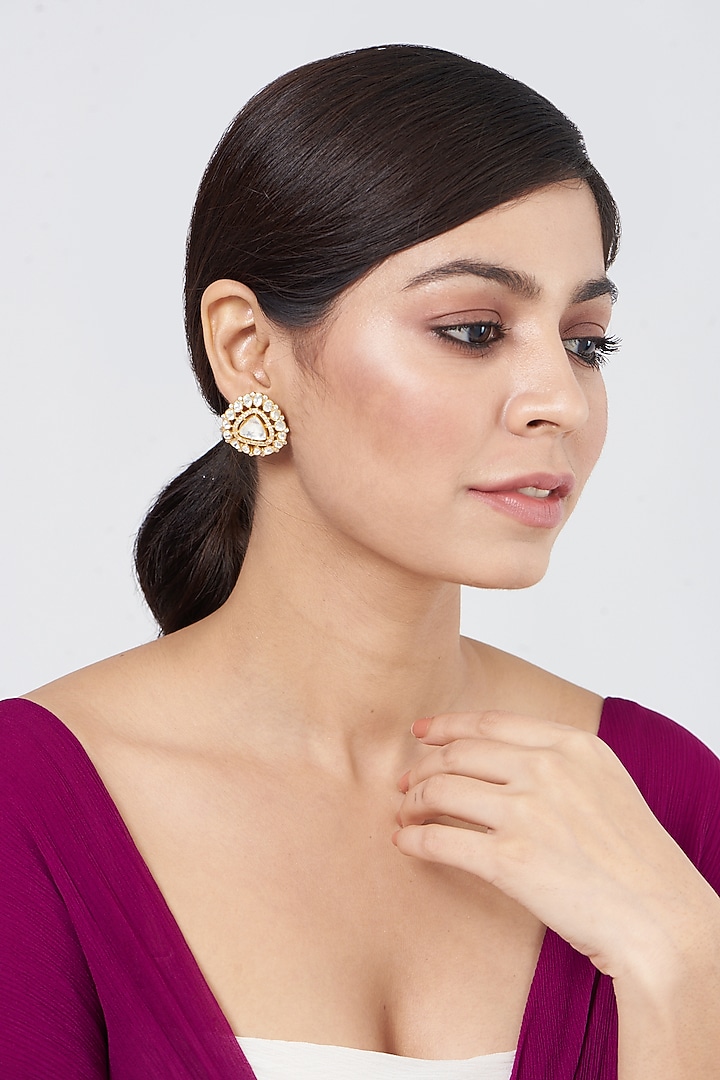 Gold Plated Kundan Polki Stud Earrings In Sterling Silver by OSVAG INDIA at Pernia's Pop Up Shop