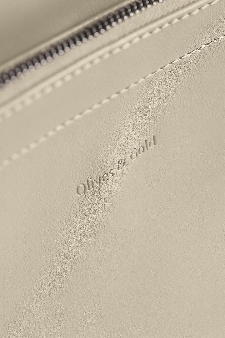 White Premium Faux Leather & Mesh Backpack Bag by OLIVES & GOLD at Pernia's Pop Up Shop