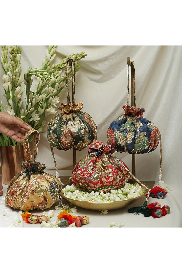 Yellow Fabric Printed & Hand Embroidered Potli by Ozel at Pernia's Pop Up Shop