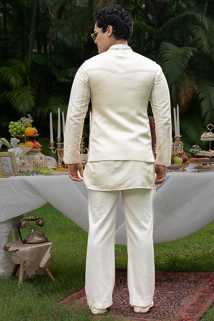 Ivory Linen Satin Hand Embroidered Bundi Jacket Set by PAARSH at Pernia's Pop Up Shop