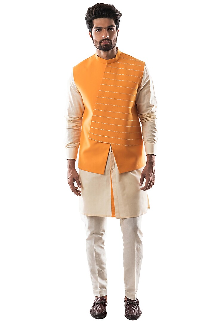 Mustard Terry Cotton Motif Embroidered Asymmetric Bundi Jacket by PAARSH at Pernia's Pop Up Shop
