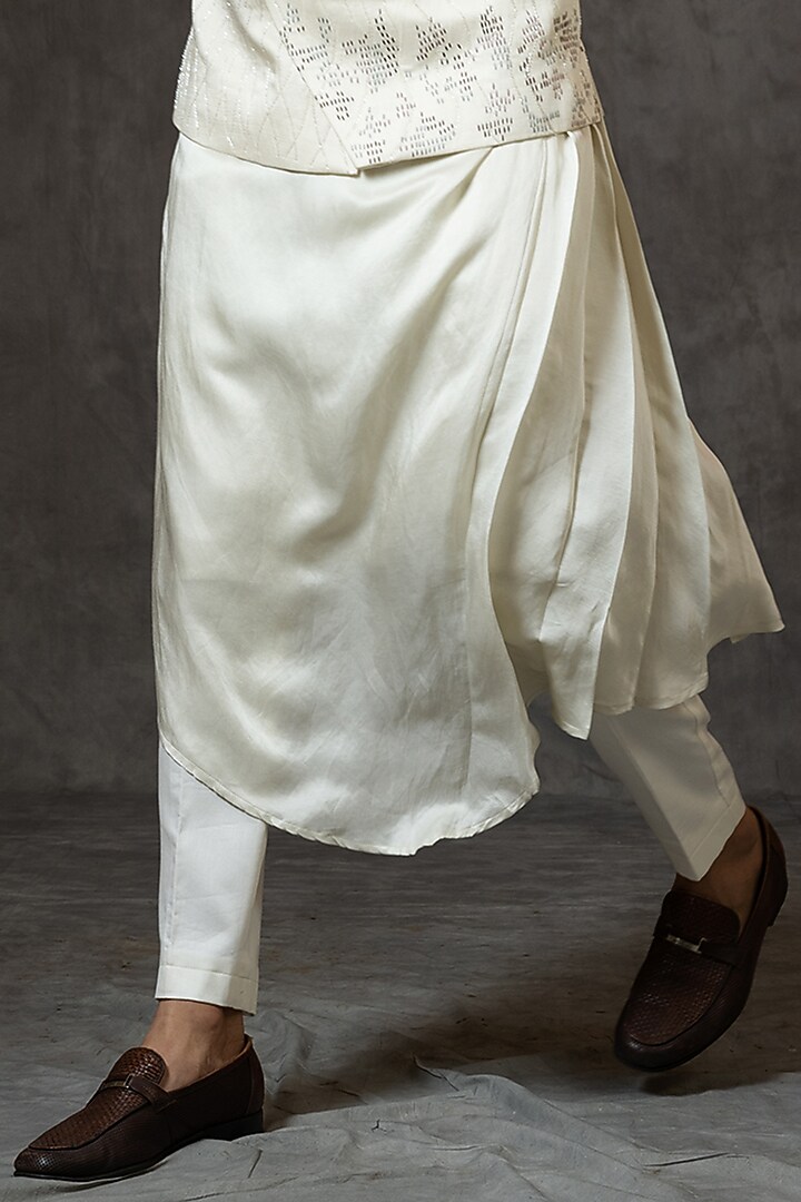 Ivory Linen Satin Cutdana Embroidered Asymmetric Bundi Jacket by PAARSH at Pernia's Pop Up Shop