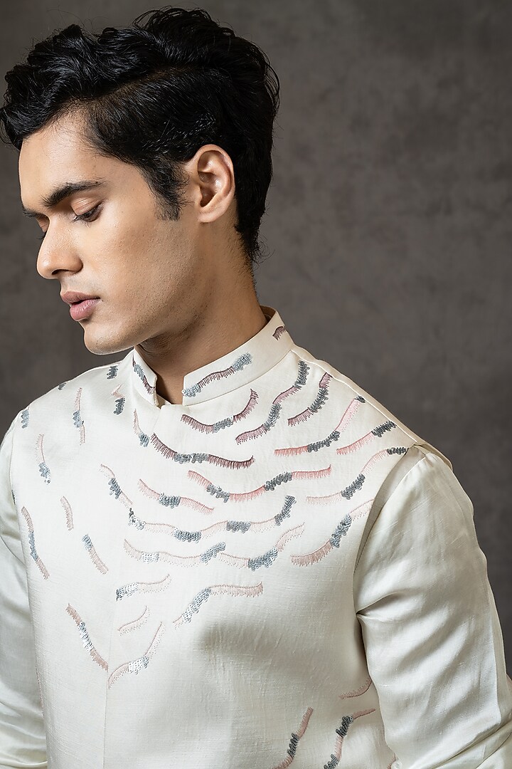 Ivory Linen Satin Sequins Embroidered Bundi Jacket by PAARSH at Pernia's Pop Up Shop