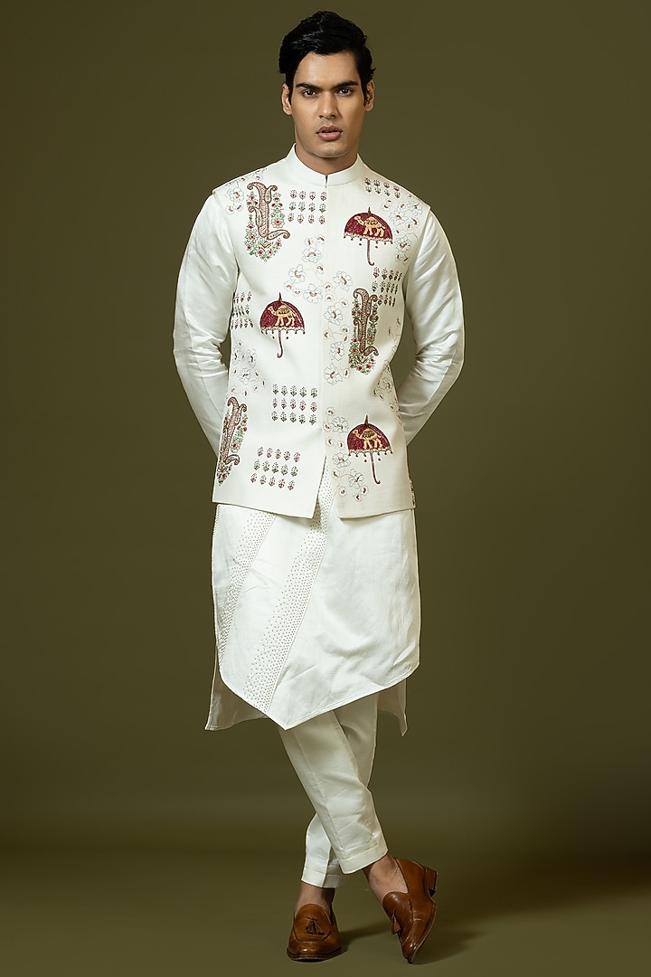 Ivory Linen Satin Kashida Embroidered Bundi Jacket by PAARSH at Pernia's Pop Up Shop