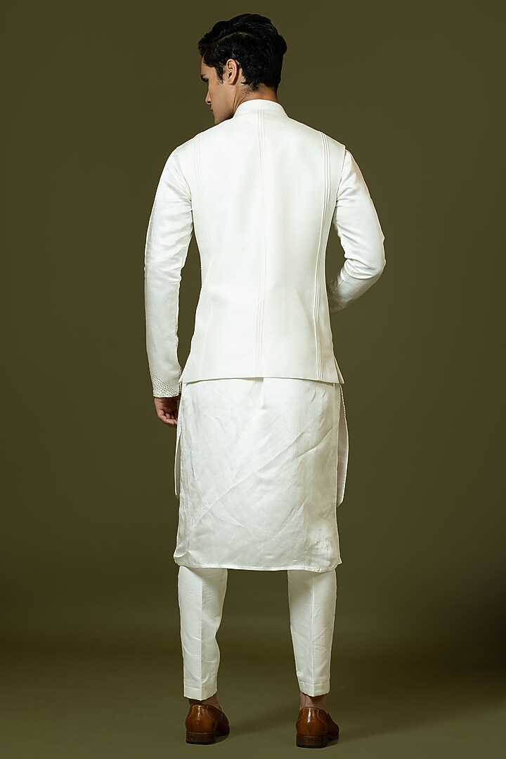 Ivory Linen Satin Kashida Embroidered Bundi Jacket by PAARSH at Pernia's Pop Up Shop
