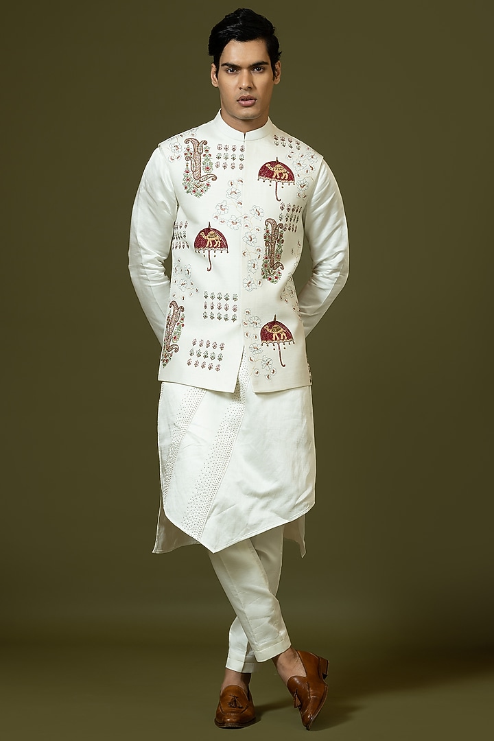 Ivory Linen Satin Kashida Embroidered Bundi Jacket Set by PAARSH at Pernia's Pop Up Shop