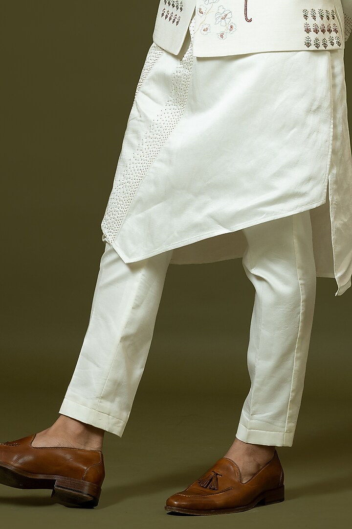 Ivory Linen Satin Kashida Embroidered Bundi Jacket Set by PAARSH at Pernia's Pop Up Shop