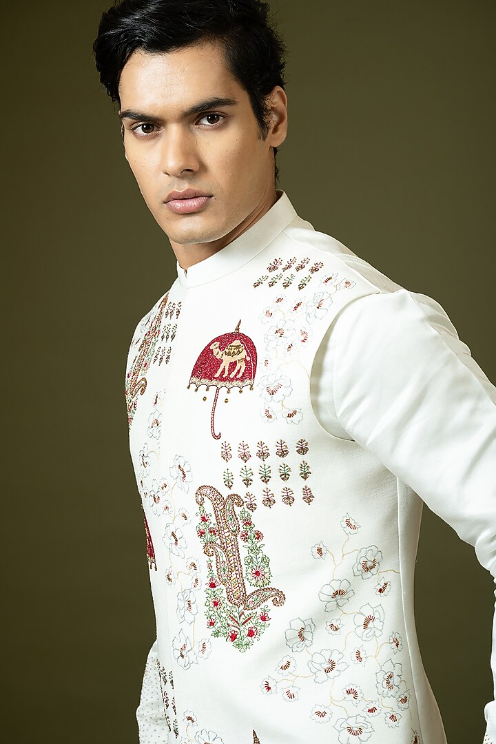 Ivory Linen Satin Kashida Embroidered Bundi Jacket Set by PAARSH at Pernia's Pop Up Shop