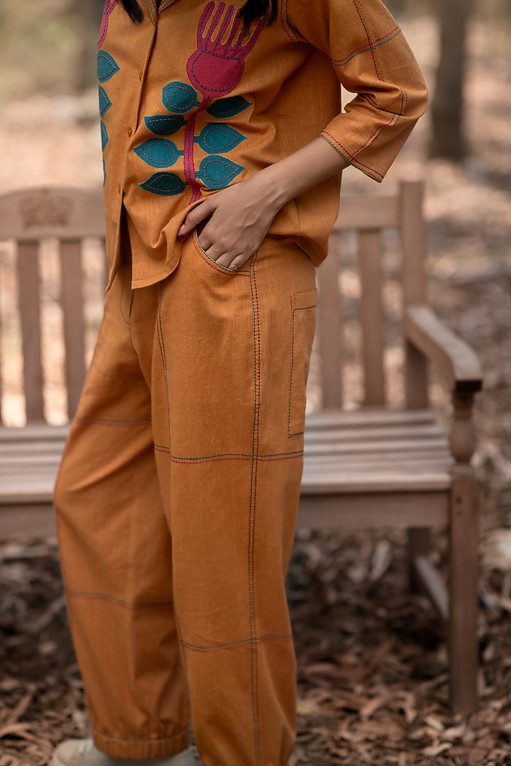 Mustard Muslin Cotton Jogger Pants by Priya Agarwal at Pernia's Pop Up Shop