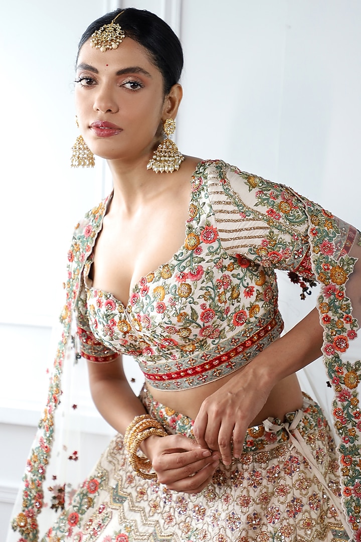 Ivory Raw Silk Embroidered Bridal Lehenga Set by Pallavi Poddar (India) at Pernia's Pop Up Shop