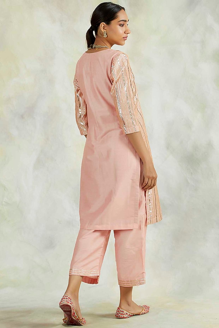 Salmon Pink Hand Embroidered Kurta Set by Palak & Mehak at Pernia's Pop Up Shop