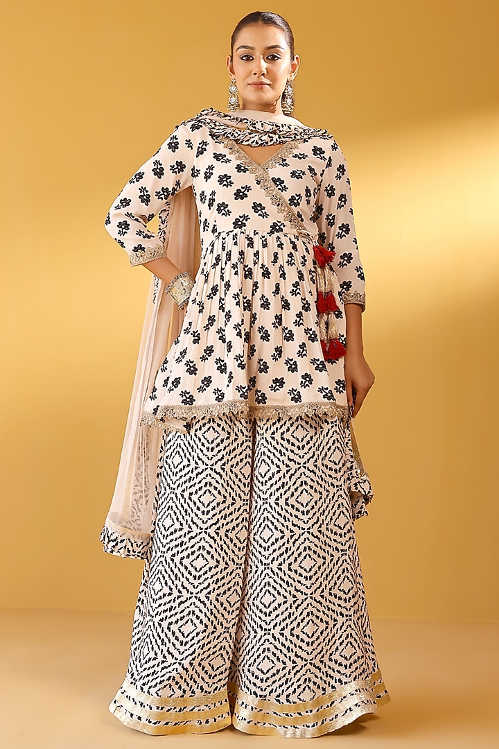 Multi-Colored Pure Crepe Embellished Peplum Kurta Set by Palak & Mehak at Pernia's Pop Up Shop