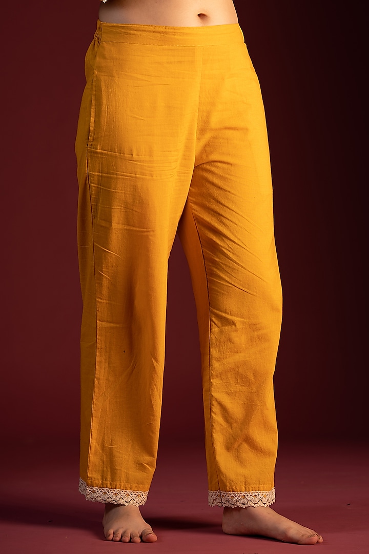 Mustard Cotton Churidar Pants Design by Pants and Pajamas at